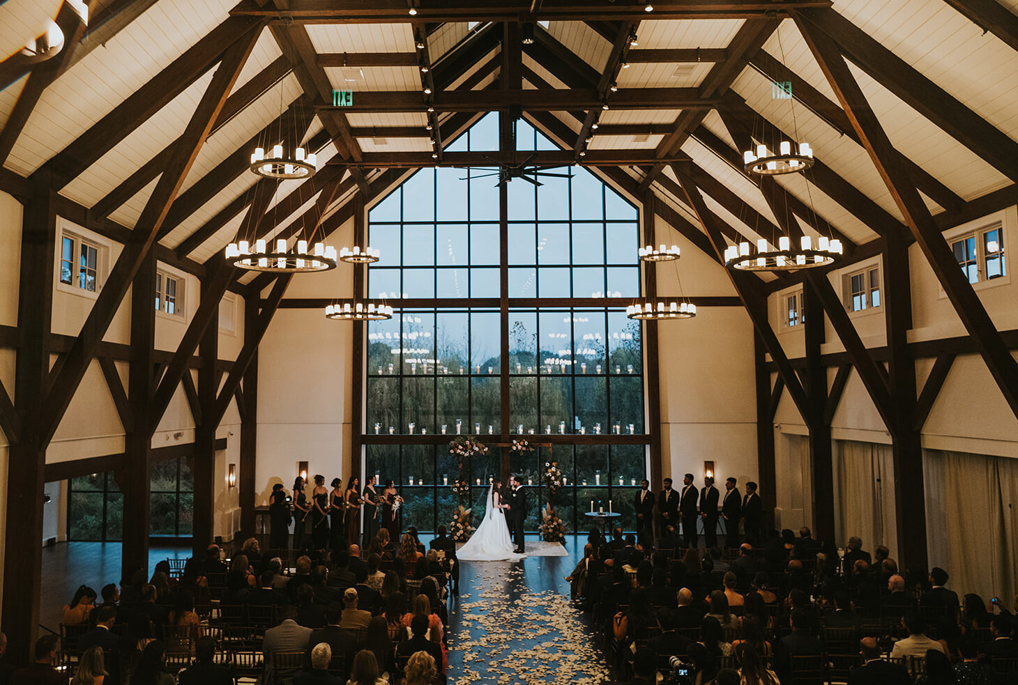 Multicultural fall wedding ceremony inside Farmhouse at upscale NJ wedding venue Crossed Keys Estate