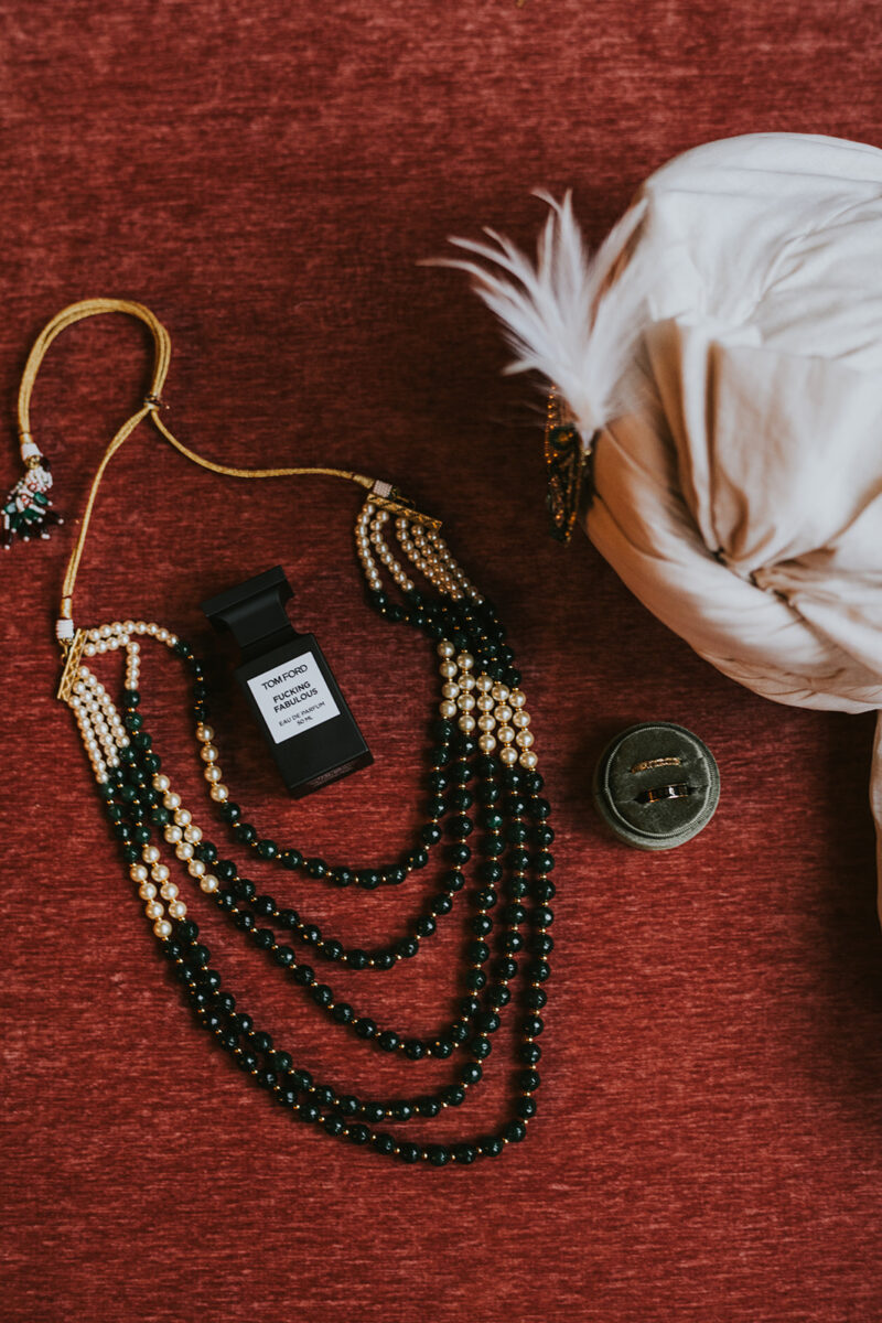 Indian Groom's flat lay jewelry ring, colage and regal turbans. Indian wedding fashion