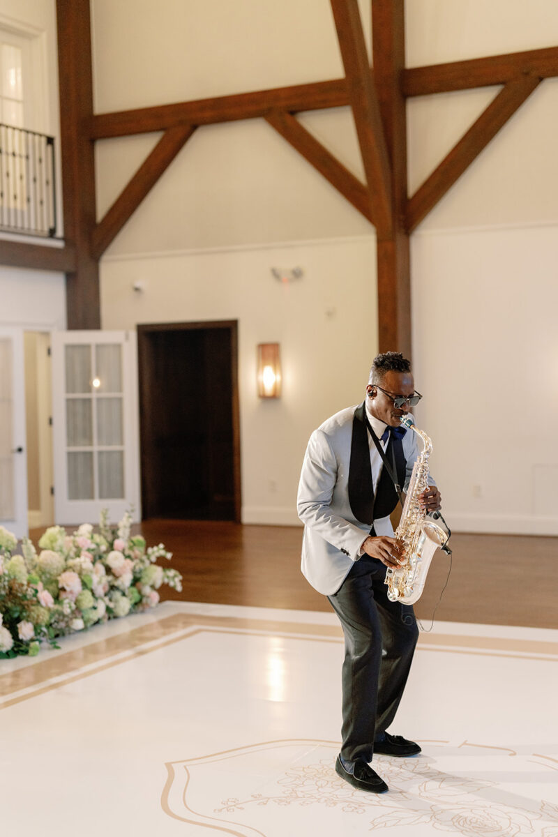 Saxophone player warming up for a reception of music and dancing
